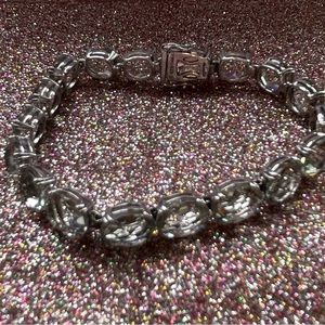 Pretty sterling silver bracelet with light green stones.